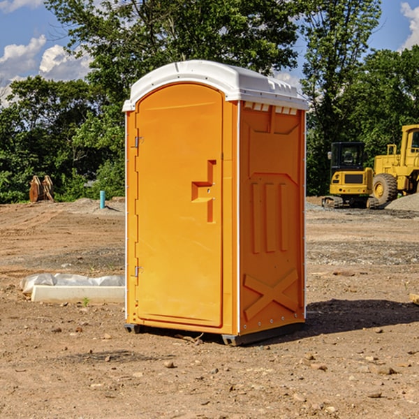 what is the cost difference between standard and deluxe portable restroom rentals in Raemon